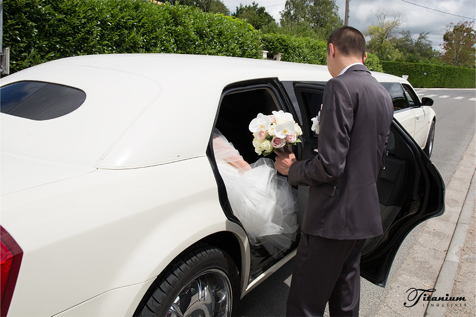 A couple in a wedding car