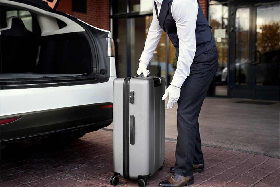 A bellboy assisting with luggage